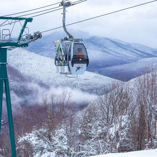 picture of Loon's gondola skyride, with NH White Mountains in background